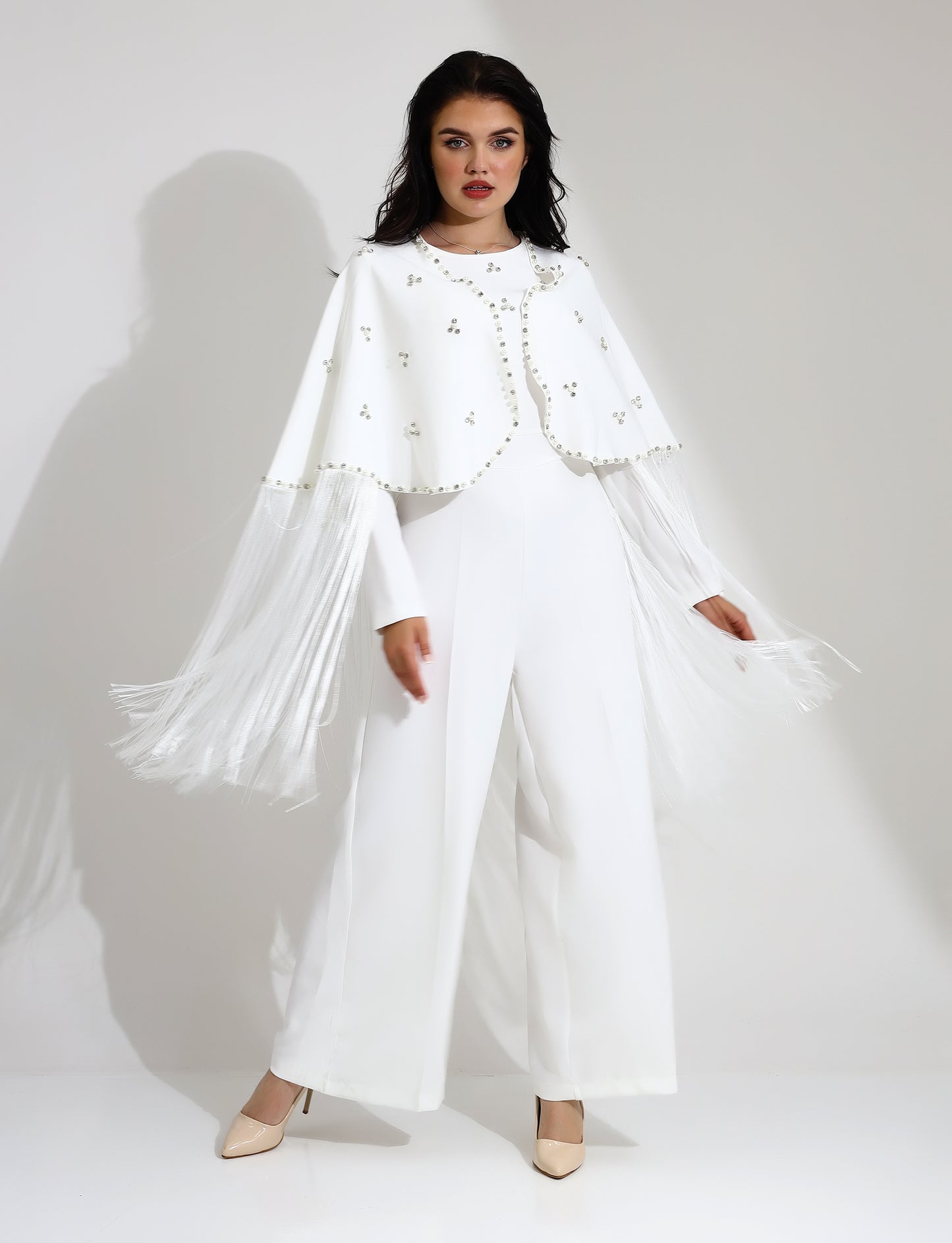 Elegant White Jumpsuit with Embellished Cape