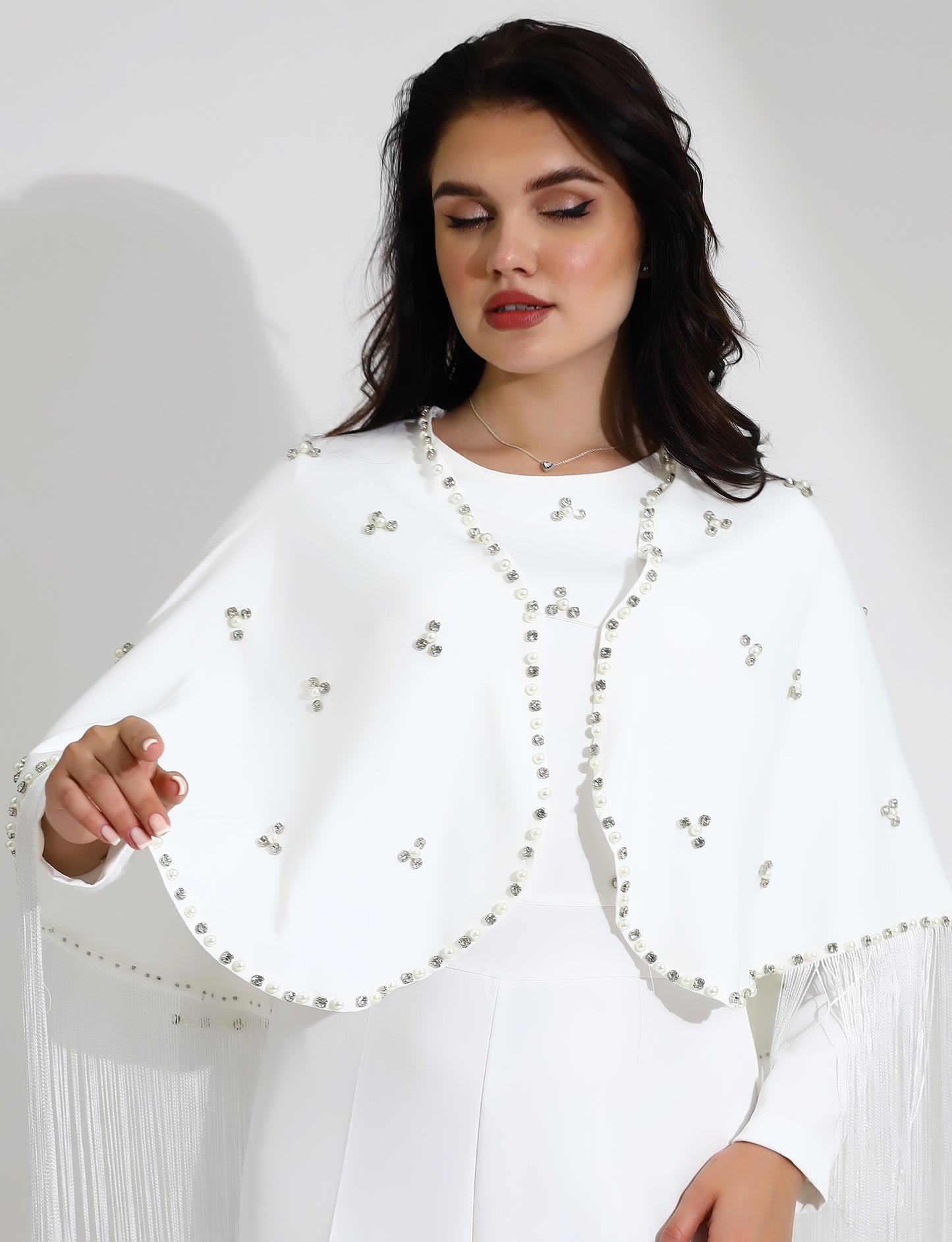 Elegant White Jumpsuit with Embellished Cape